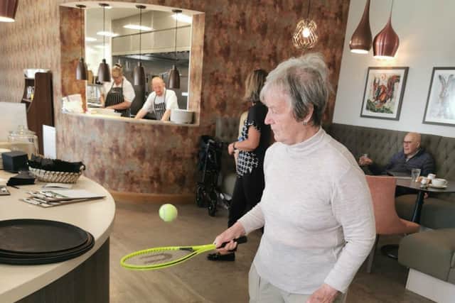 Resident Mary Stark showing off her tennis skills at Landale Court