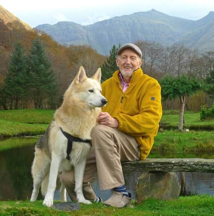 Hamish MacInnes with one of the Search and Rescue dogs at his home in Glencoe