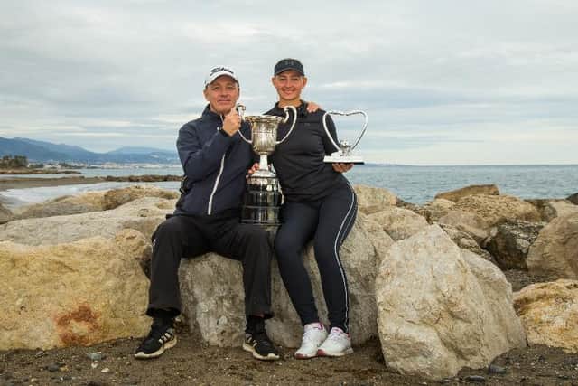shows off her trophies with dad/caddie Jesper in Spain. Picture: Tristan Jones