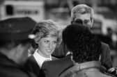A still from The Princess: Diana, Princess of Wales is surrounded by police and security as she arrives for a visit to Harlem Hospital's pediatric AIDS unit in Harlem New York, February 1989