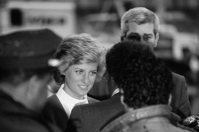 A still from The Princess: Diana, Princess of Wales is surrounded by police and security as she arrives for a visit to Harlem Hospital's pediatric AIDS unit in Harlem New York, February 1989