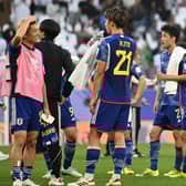 Japan's players look on disbelief after losing 2-1 to Iraq at the Asian Cup.