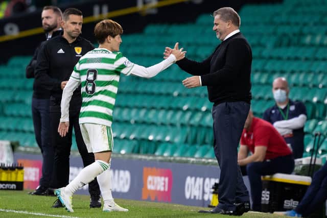 Ange Postecoglou congratulates Kyogo Furuhashi after withdrawing the striker to standing ovation following his hat-trick in the club's 6-0 thumping of Dundee. (Photo by Craig Williamson / SNS Group)