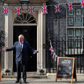 Boris Johnson speaks with stallholders during an event to promote British businesses at Downing Street yesterday (Picture: Toby Melville /WPA pool/Getty Images)