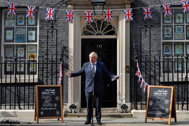 Boris Johnson speaks with stallholders during an event to promote British businesses at Downing Street yesterday (Picture: Toby Melville /WPA pool/Getty Images)