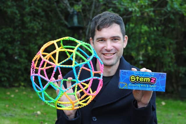 Mr Lind hails StemZ marking its fifth anniversary by donating some of the toys to RNIB and The Donaldson Trust. Picture: contributed.