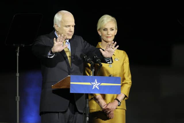 The late Republican Senator John McCain during his concession speech after the 2008 election and his wife Cindy, who endorsed Joe Biden (Picture: Elise Amendola/AP file)