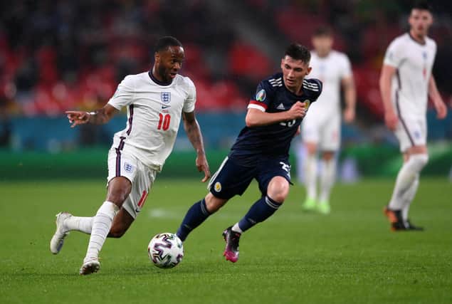 Scotland's Billy Gilmour keeps tabs on England's Raheem Sterling.