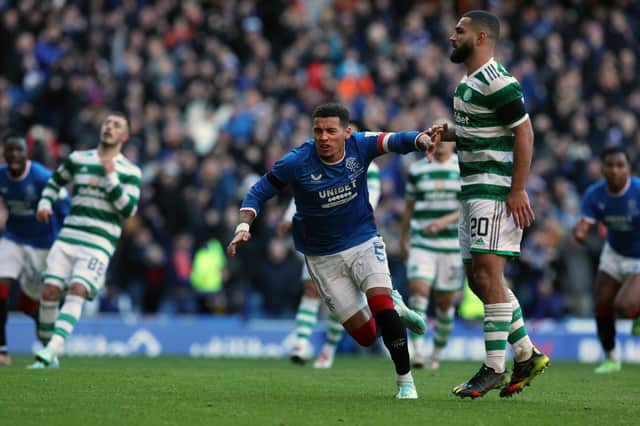 James Tavernier runs off to celebrate after converting his penalty for Rangers against Celtic.