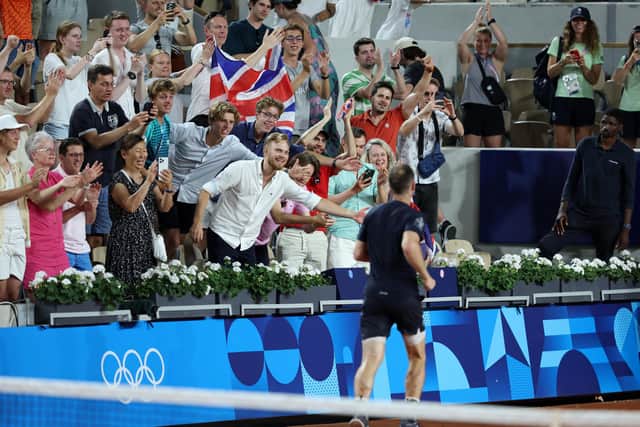 Andy Murray celebrates with fans after the men's doubles second round win alongside Dan Evans at the Paris Olympics. (Photo by Clive Brunskill/Getty Images)