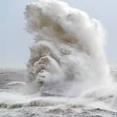 Huge waves crash against the lighthouse in Seaham Harbour, County Durham, in the tail end of Storm Arwen