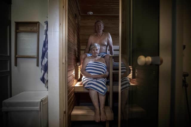 Fins like Leena and Bo Stahl are particularly fond of warming saunas (Picture: Olivier Morin/AFP via Getty Images)