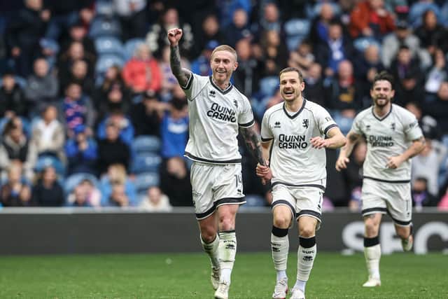 Dundee United's Craig Sibbald celebrates his goal to make it 2-1 to his side in front of dismayed Rangers supporters  (Photo by Alan Harvey / SNS Group)