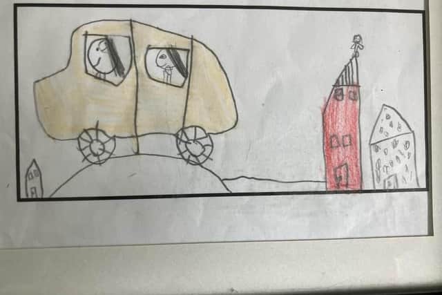 Mum's the Word. Youngest Child's drawing of us in the wee red car negotiating a sleeping policeman as Middle Child watches from the roof of our house. Pic: J Christie