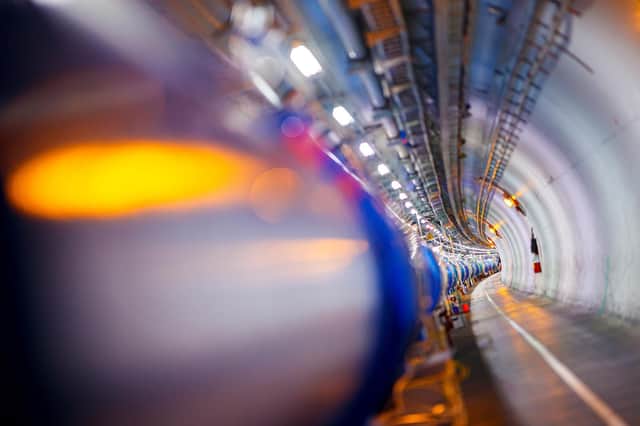 Some dipole magnets bend the path of accelerating protons at the Large Hadron Collider (LHC) in a CERN tunnel (Photo: Valentin Flauraud/AFP via Getty Images)