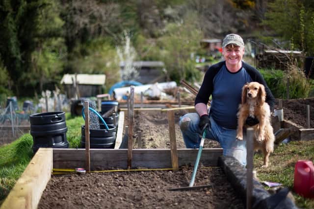 Willie McGhee, who has worked in both commercial and community forestry for the past three decades and is a board member of the Forest Policy Group think tank, with his dog Holly