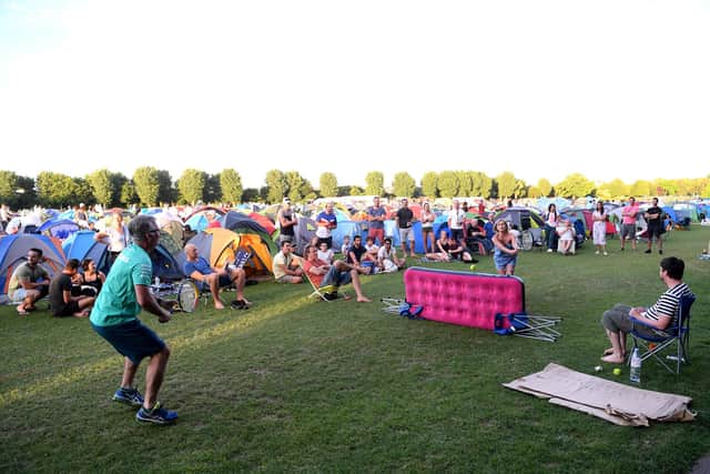 The snake of people and tents in Wimbledon Park has become one of the defining sights of the event as tennis fans camp out overnight to secure access to the show courts. Picture: Laurence Griffiths/Getty Images