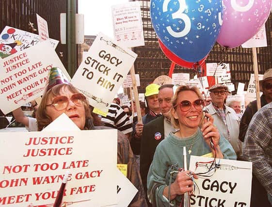 Demonstrators supporting the scheduled execution of serial killer John Wayne Gacy. (Photo credit should read EUGENE GARCIA/AFP via Getty Images)