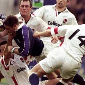 Alan Tait of Scotland forces his way over to score against England in the Calcutta Cup Five Nations match at Twickenham in 1999.