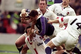 Alan Tait of Scotland forces his way over to score against England in the Calcutta Cup Five Nations match at Twickenham in 1999.