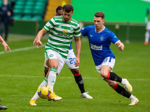 Celtic's Albian Ajeti (left) holds off Rangers' Ryan Jack.