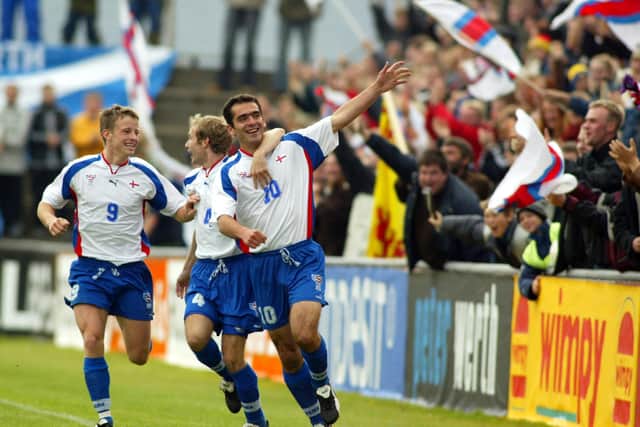Faroe Islands striker John Petersen (right) celebrates his shock opener after only six minutes in the 2-2 draw with Scotland in 2002