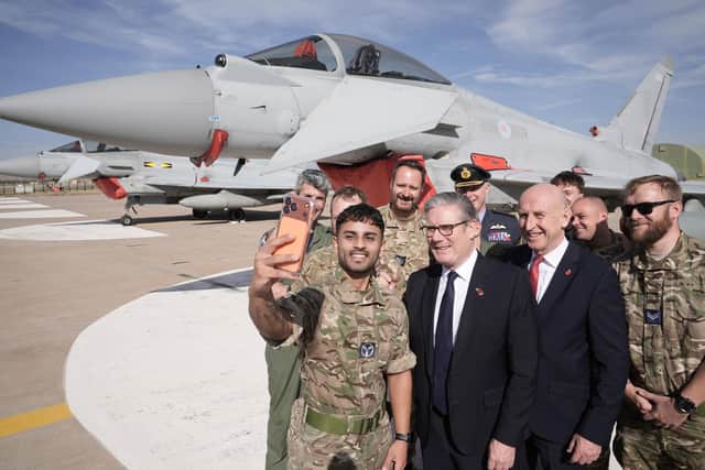 Prime Minister Sir Keir Starmer (centre) and Defence Secretary John Healey (right) pose for a selfie with British armed forces personnel in front of a UK Typhoon fighter jet at Tusas airbase in Ankara. Picture: Stefan Rousseau/PA Wire
