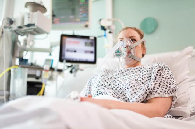A volunteer patient demonstrating a continuous positive airway pressure (CPAP) breathing aid that can help keep Covid-19 patients out of intensive care. Picture: James Ty/UCL/PA Wire