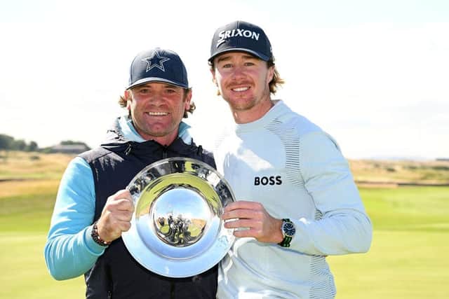Sean Crocker and his Scottish caddie Steve Pettit with the Hero Open trophy after the American's win at Fairmont St Andrews. Picture: Ross Kinnaird/Getty Images.