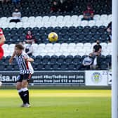 St Mirren striker Curtis Main leaps between Dunfermline duo Kyle Macdonald and Aaron Comrie to score in the Premier Sports Cup match in Paisley. (Photo by Alan Harvey / SNS Group)