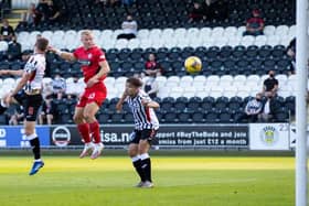 St Mirren striker Curtis Main leaps between Dunfermline duo Kyle Macdonald and Aaron Comrie to score in the Premier Sports Cup match in Paisley. (Photo by Alan Harvey / SNS Group)