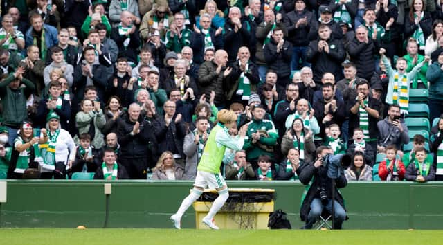Celtic's Kyogo Furuhashi applauds the fans as he warms up in the first half against St Johnstone. (Photo by Craig Williamson / SNS Group)