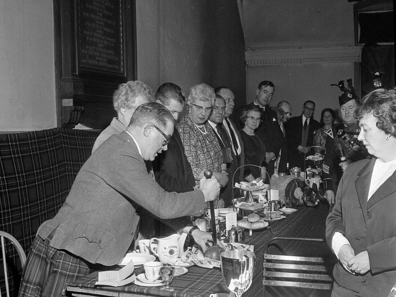 Cutting the haggis at the 7/9th Royal Scots Association Burns Supper in 1963.