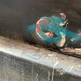 A vandalised painting on a building in Glasgow, which some thought was the work of Banksy, is to be removed (Picture: Jonny Holliday/PA Wire)