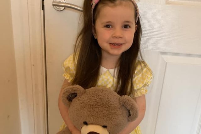 Molly, age 3, as Goldilocks. And she's even brought one of the three bears along!