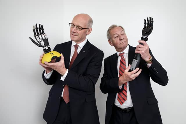 John Swinney MSP and Rutterford in 2015 with hands from Touch Bionics. Picture: Robert Perry.