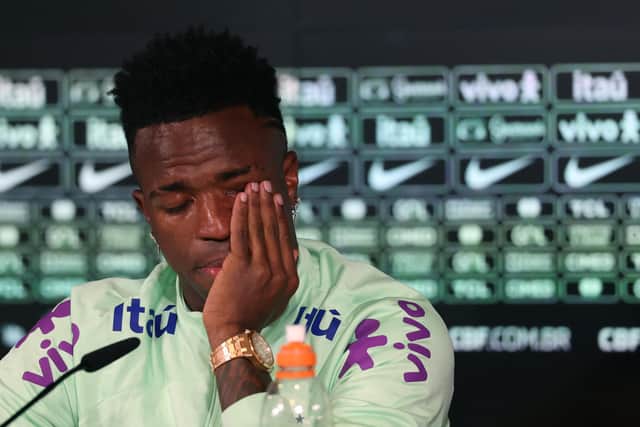 Brazil's forward Vinicius Junior cries as he gives a press conference on the eve of the international friendly football match between Spain and Brazil.
