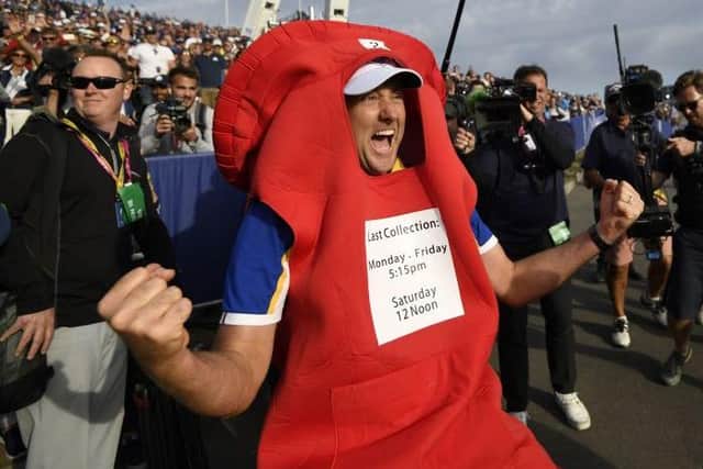 Ian Poulter wears a post box costume as he celebrates the 2018 win in France. Picture: Eric Feferberg/AFP via Getty Images.