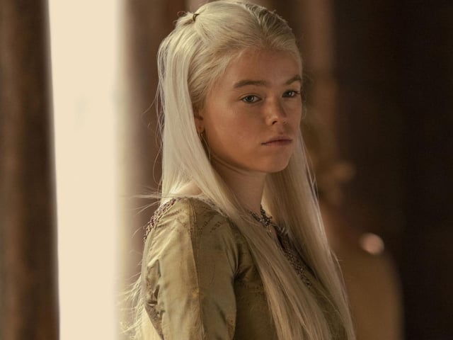 Princess Rhaenyra Targaryen, played by Milly Alcock and later Emma D'Arcy, is the firstborn child of King Viserys Targaryen with Queen Aemma Arryn. Nicknamed the 'Realm's Delight', Rhaenyra is declared heir to the Iron Throne by her father. But there are many in the realm who do not think a woman should rule.