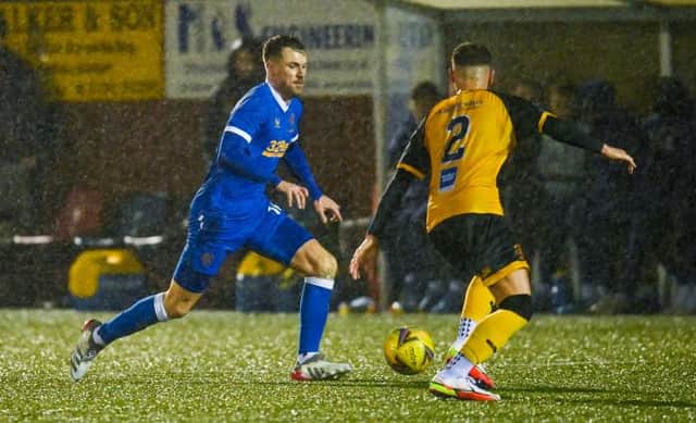 Aaron Ramsey is challenged by Annan Athletic's Charlie Barnes during his first starting appearance for Rangers. (Photo by Rob Casey / SNS Group)