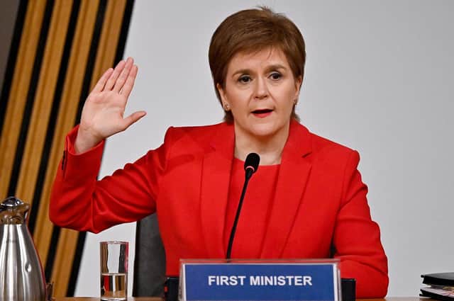 Nicola Sturgeon takes the oath before giving evidence to the Committee on the Scottish Government Handling of Harassment Complaints (Picture: Jeff J Mitchell/PA)