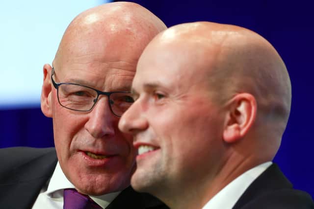EFirst Minister John Swinney talks with Stephen Flynn, leader of the SNP Westminster group, before he addresses delegates on day two of the SNP conference at Edinburgh International Conference Centre. Picture: Jeff J Mitchell/Getty Images
