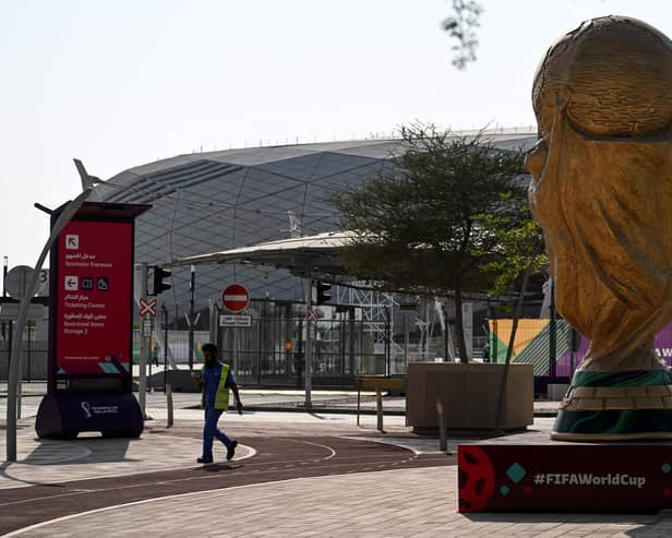 A man walks past a World Cup trophy replica outside the Education City Stadium in Al-Rayyan ahead of the Qatar 2022 World Cup football tournament. Picture: Kirill Kudryavtsev/AFP via Getty Images