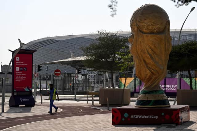 A man walks past a World Cup trophy replica outside the Education City Stadium in Al-Rayyan ahead of the Qatar 2022 World Cup football tournament. Picture: Kirill Kudryavtsev/AFP via Getty Images