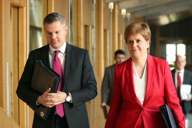 Derek Mackay and Nicola Sturgeon, pictured before the former resigned in disgrace in 2020. Picture: Jane Barlow/PA Wire