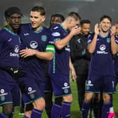 The Hibs players celebrate their 1-0 win over Livingston in West Lothian.