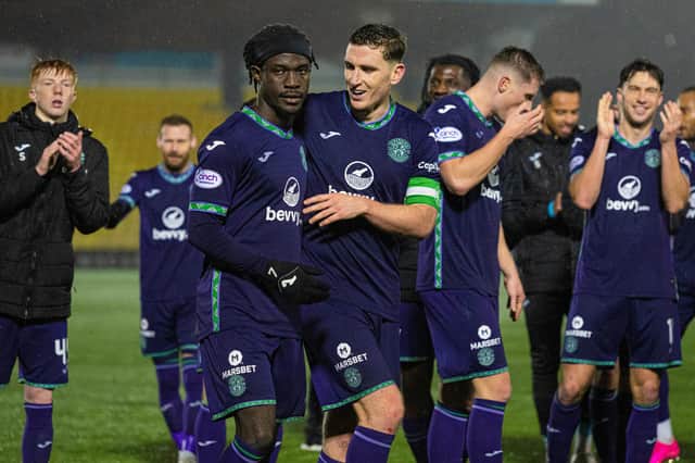The Hibs players celebrate their 1-0 win over Livingston in West Lothian.