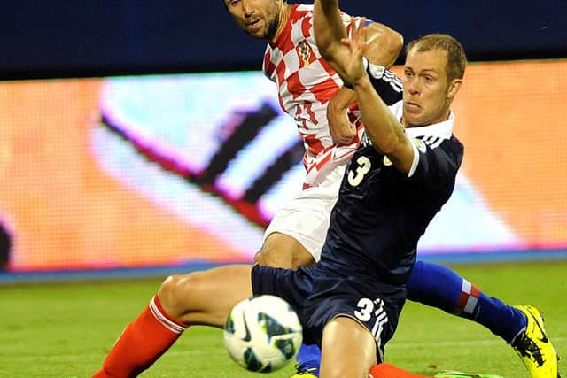 Helping Scotland beat Croatia in a World Cup qualifier in Zagreb in 2013.