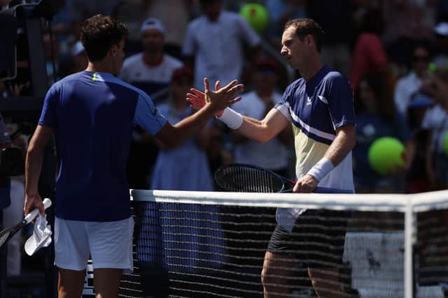 Andy Murray shakes hands with Francisco Cerundolo after winning the first round men's singles match at the US Open. (Photo by Julian Finney/Getty Images)