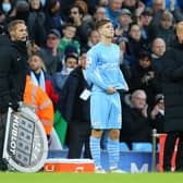 James McAtee with Manchester City manager Pep Guardiola as he prepares to make his Premier League debut for the English champions against Everton in November 2021. (Photo by Alex Livesey/Getty Images)